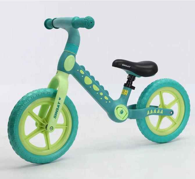 Bicicleta de equilibrio verde con diseño dinosaurio para desarrollo motriz infantil